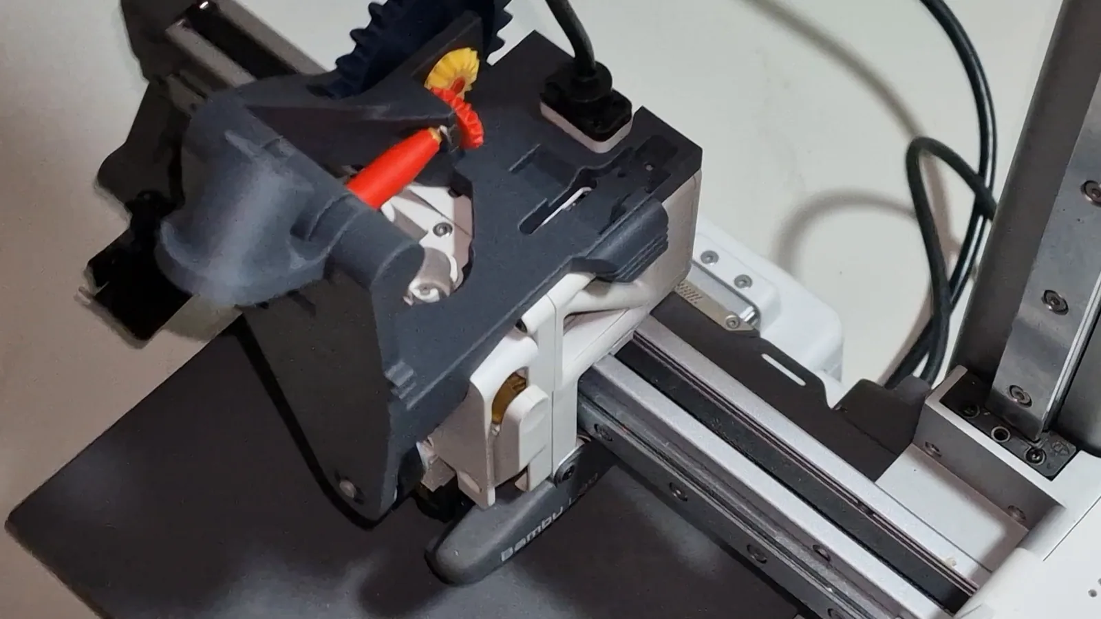 The printed Mechams mechanism mounted on a Bambu Lab A1 mini, before the funnel and sensor go on